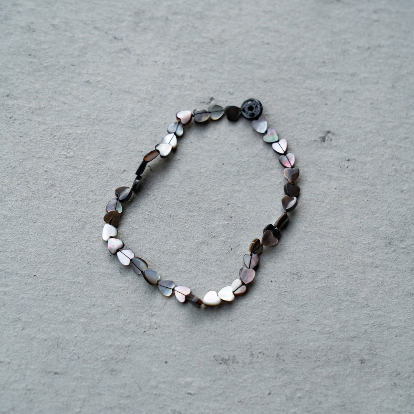 Melanie Decourcey Black mother of pearl heart shaped beads DNA bracelet