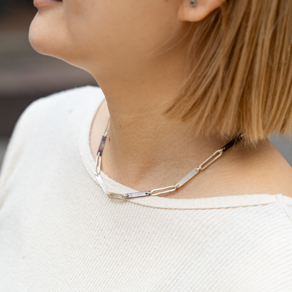 Melanie Decourcey Black/White mother of pearl with Oval silver links necklace