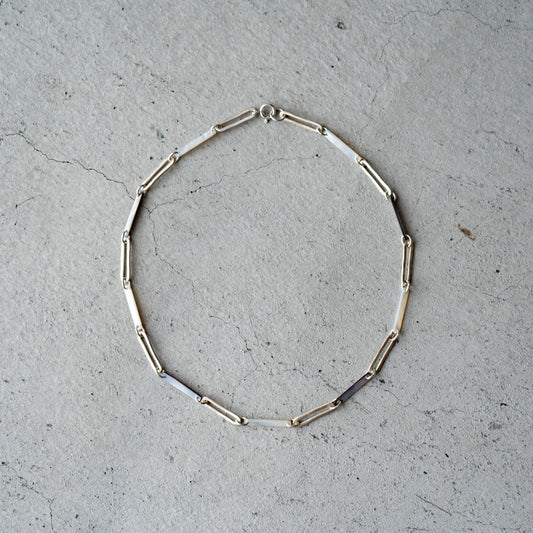 Melanie Decourcey Black/White mother of pearl with Oval silver links  necklace