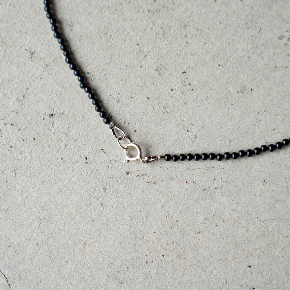 Melanie DeCourcey Small onyx with mother of pearl moon