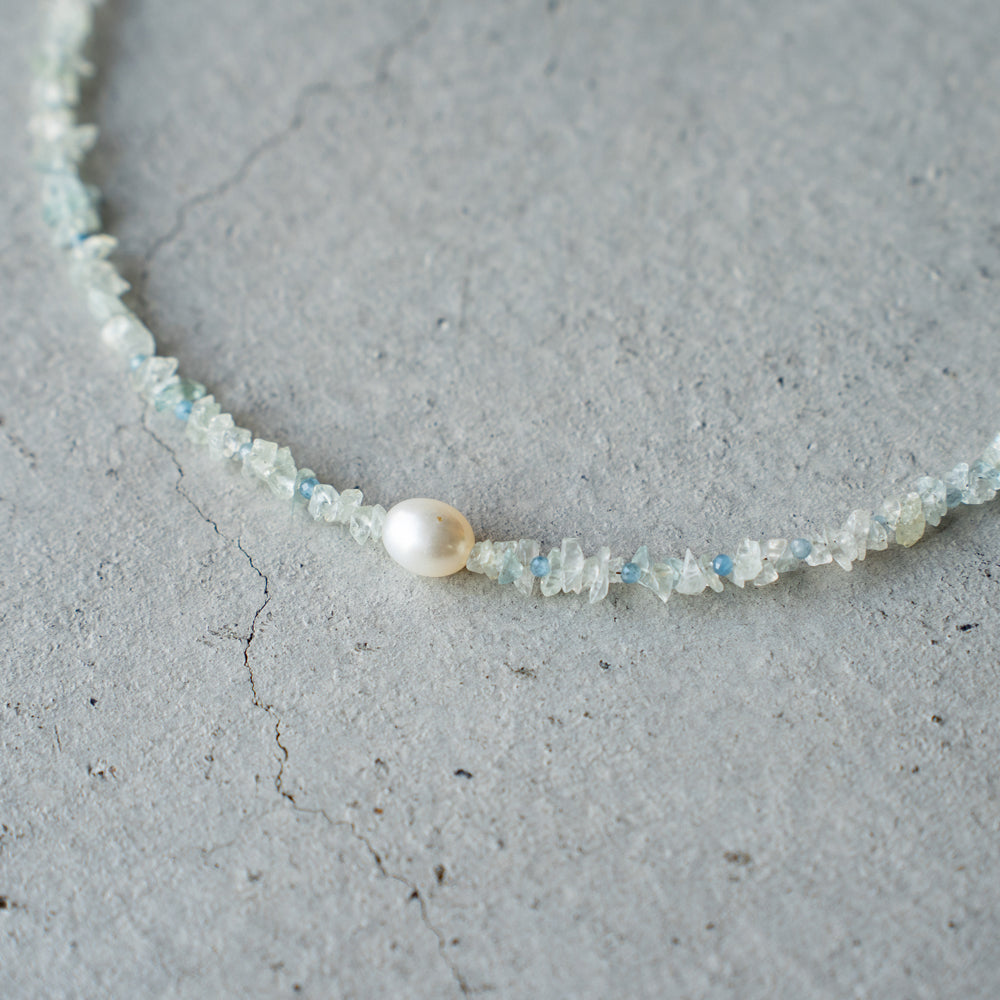 Melanie Decourcey Aquamarine beads with pearl center