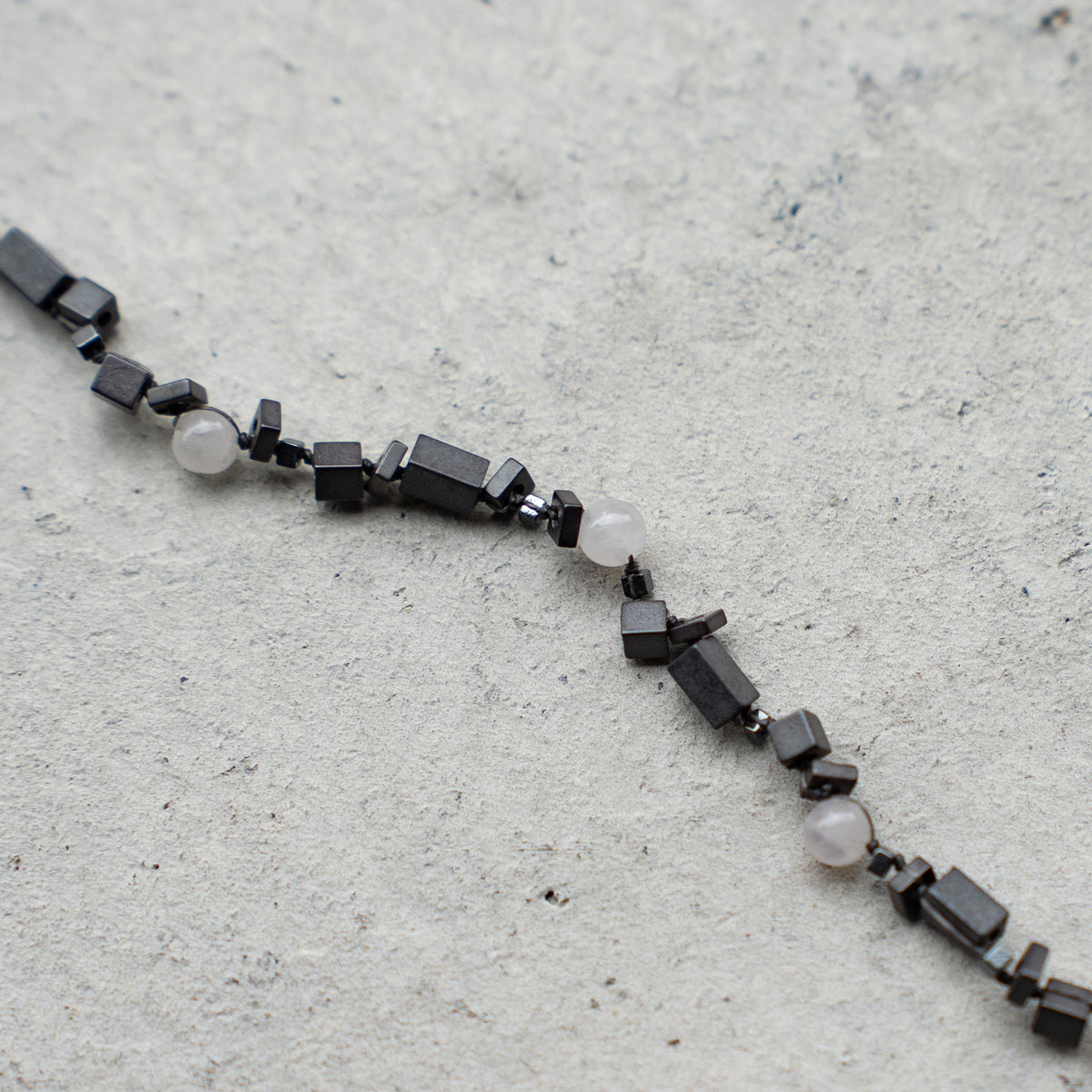 Melanie DeCourcey DNA different shape hematite and rose quartz blacelet