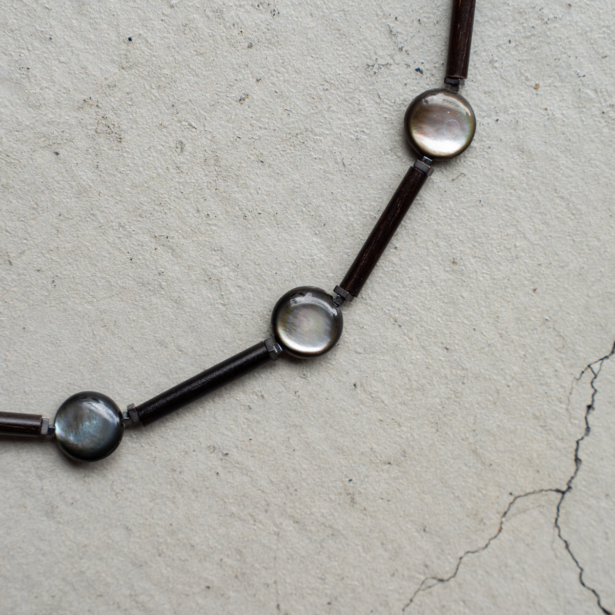 Melanie DeCourcey Wood, small hematite and black mother of pearl