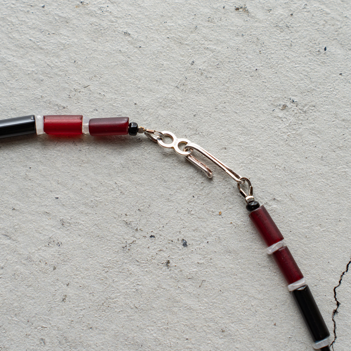 Melanie DeCourcey Red African glass beads, onyx, moonstone