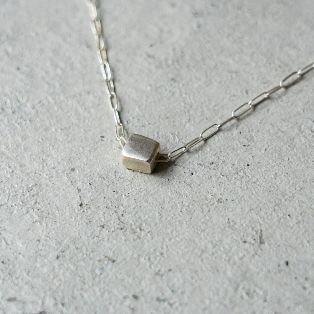 Melanie DeCourcey Silver cube on chain