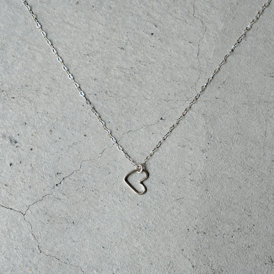 Melanie DeCourcey  Heart shaped silver chain with freestyle pendant