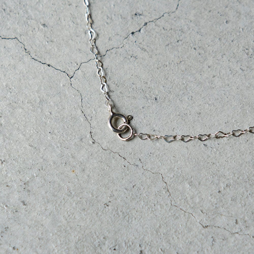 Melanie DeCourcey Heart shaped silver chain with freestyle pendant