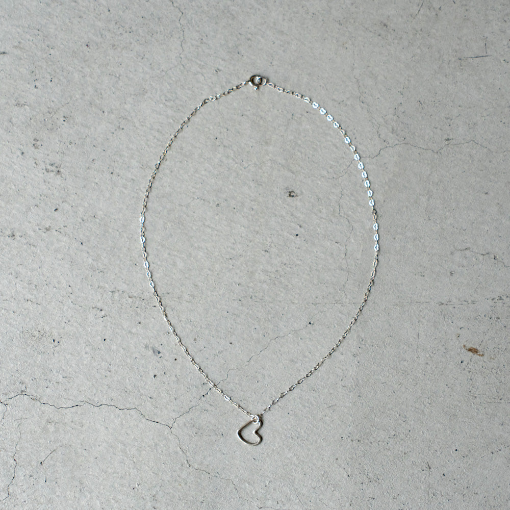 Melanie DeCourcey Heart shaped silver chain with freestyle pendant