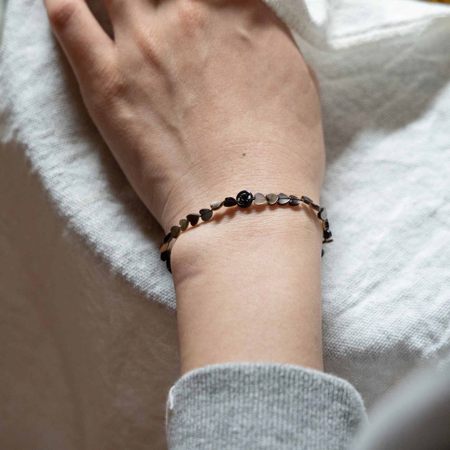 Melanie Decourcey Black mother of pearl heart shaped beads DNA bracelet