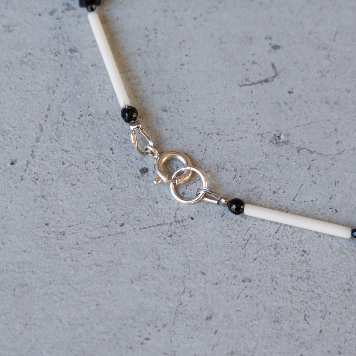 Melanie Decourcey Ivory color glass tubes alternating with onyx cube