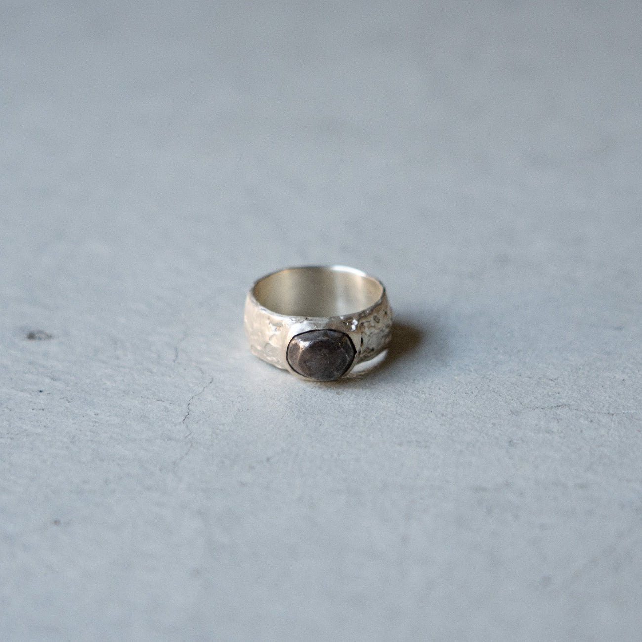 Melanie Decourcey Textured silver ring with oxidized silver dome