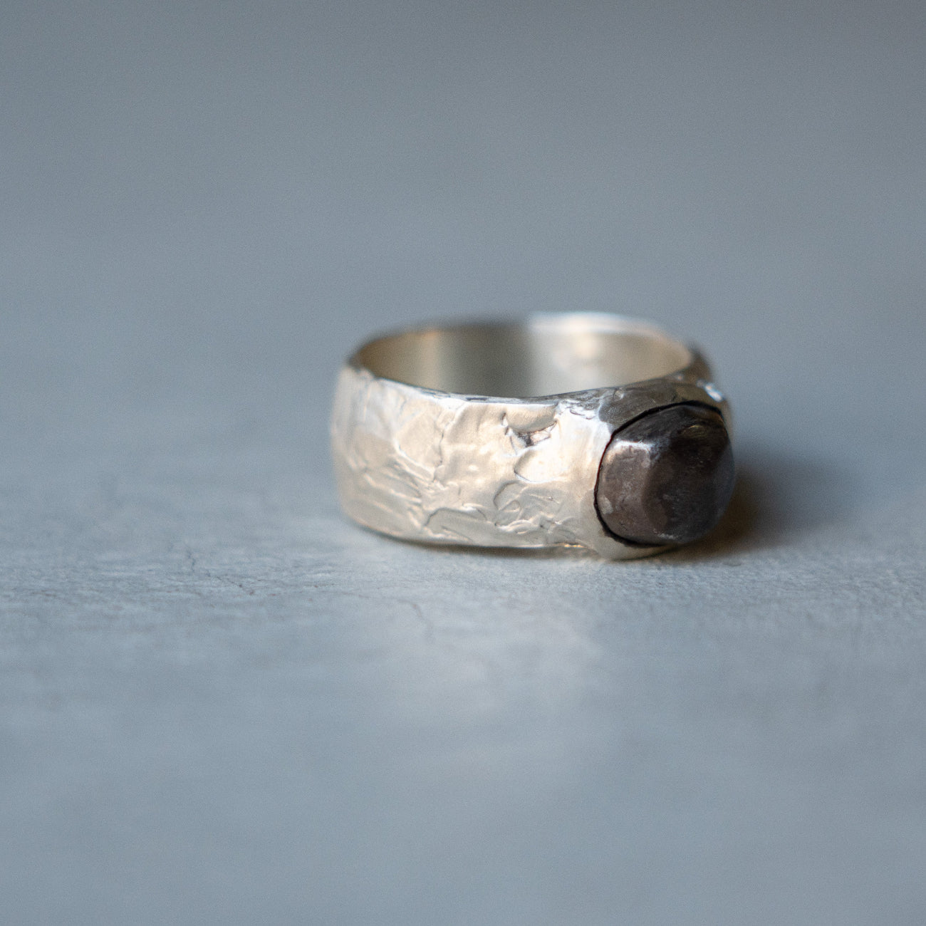 Melanie Decourcey Textured silver ring with oxidized silver dome