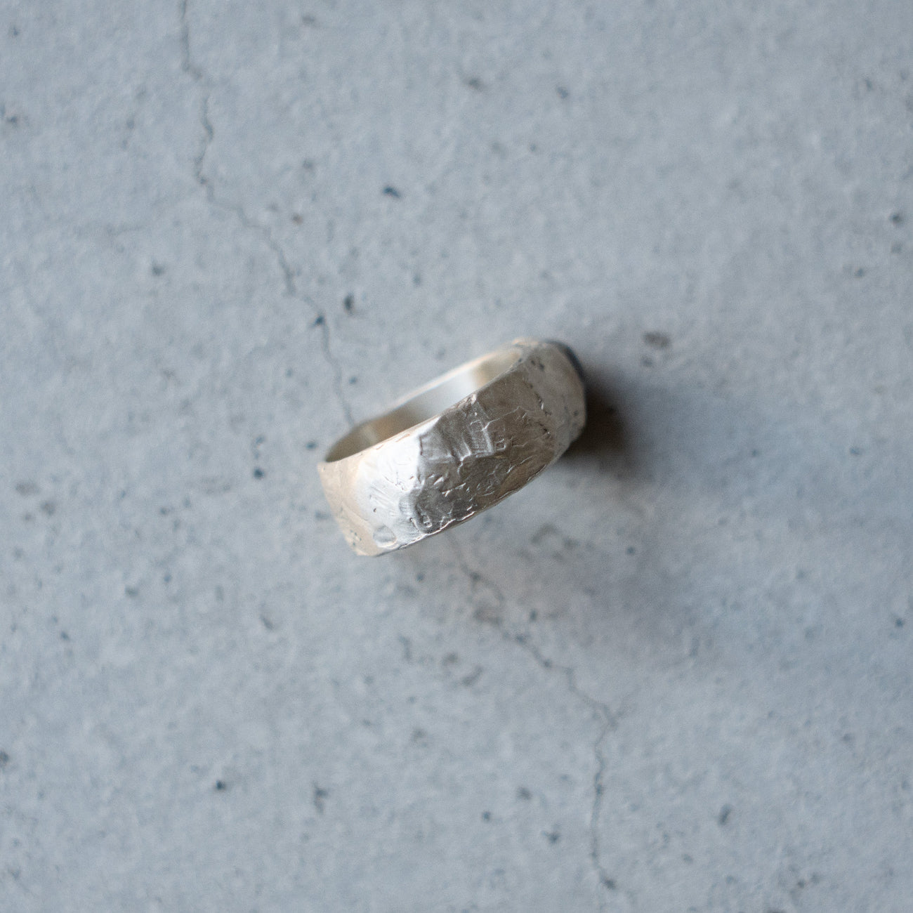 Melanie Decourcey Textured silver ring with oxidized silver dome