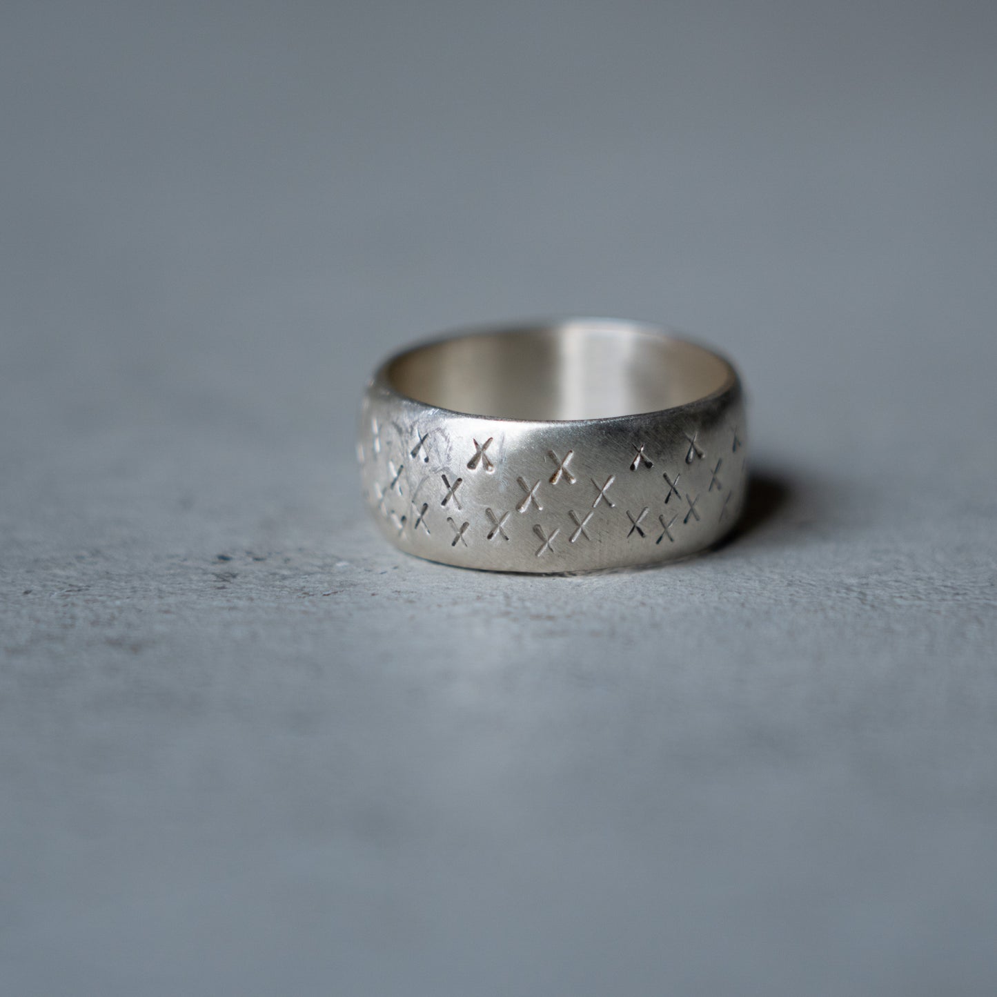 Melanie Decourcey Silver ring with XXX texture and ruby/black diamond