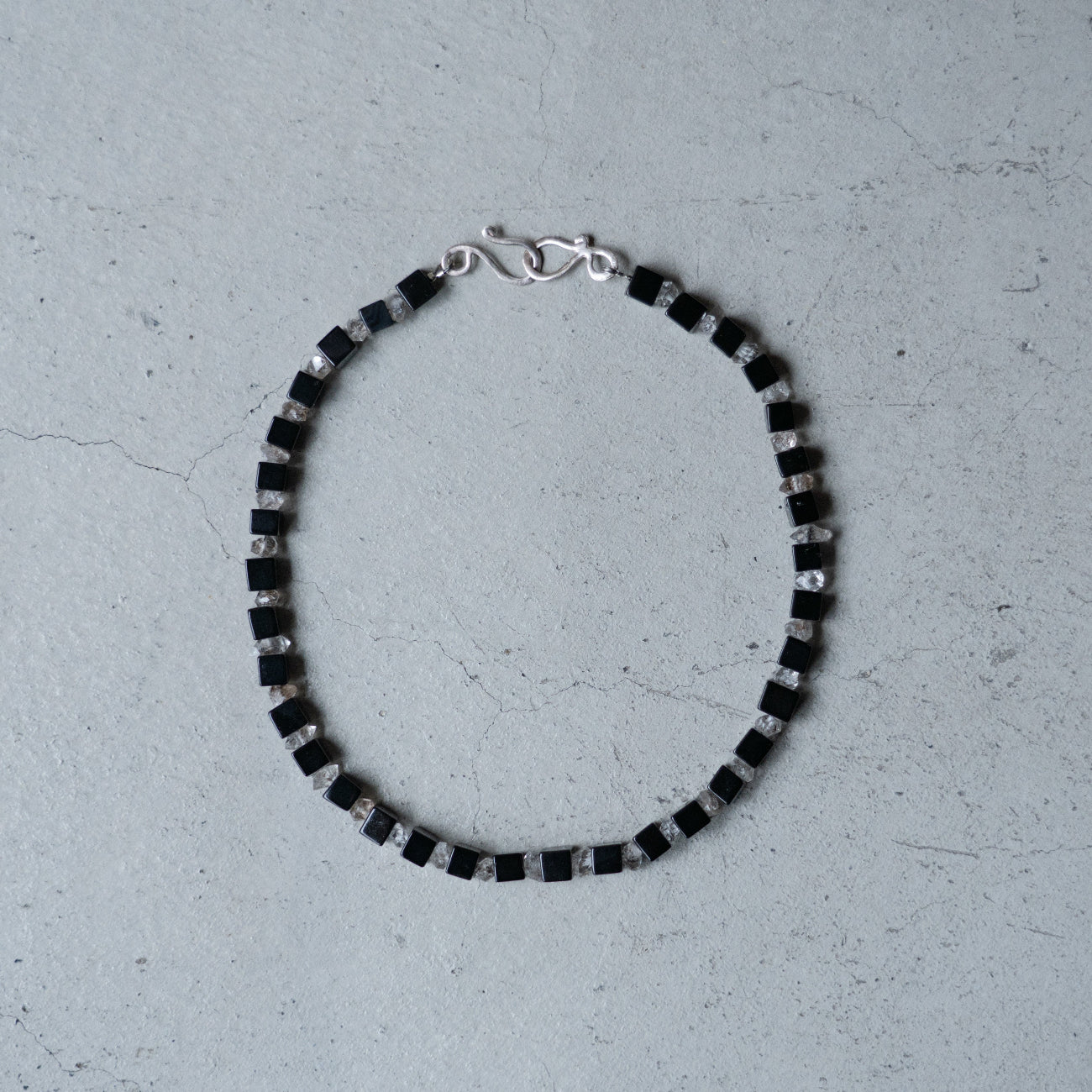 Melanie Decourcey Onyx cubes alternating with herkimer diamonds