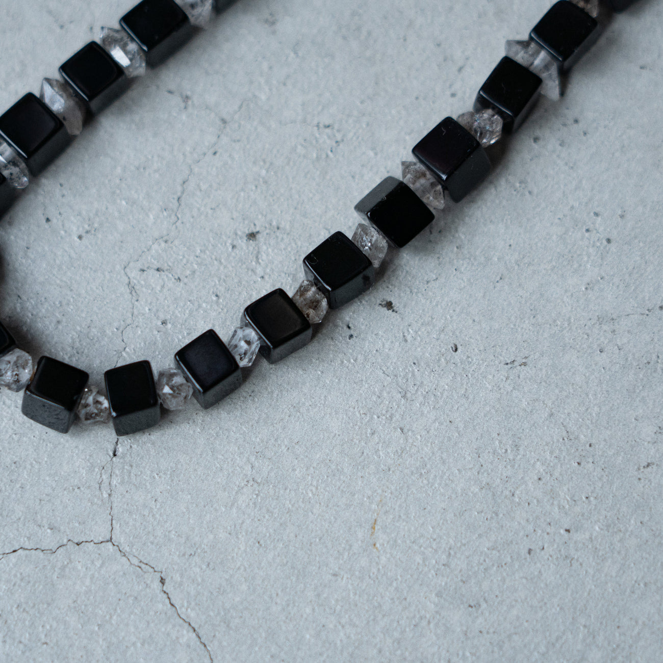 Melanie Decourcey Onyx cubes alternating with herkimer diamonds