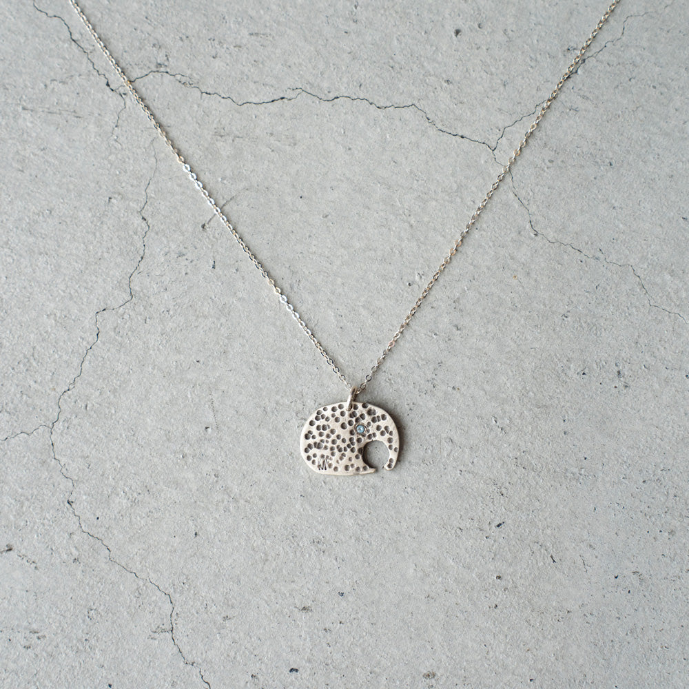 Melanie DeCourcey Elephant with small aquamarine on silver chain