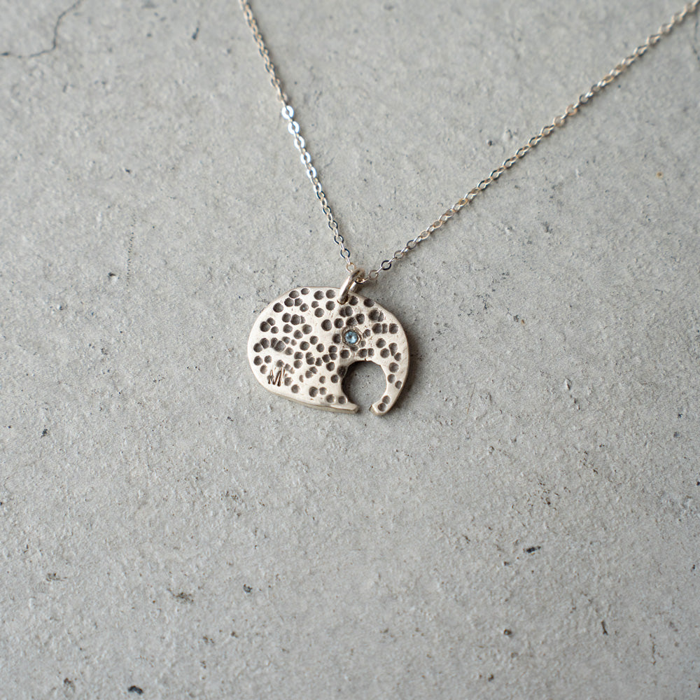 Melanie DeCourcey Elephant with small aquamarine on silver chain