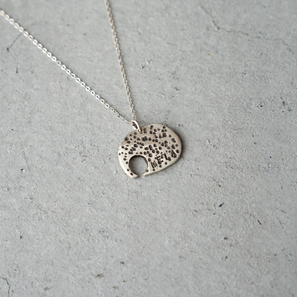 Melanie DeCourcey Elephant with small aquamarine on silver chain