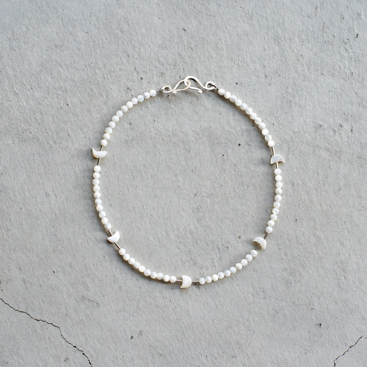 Melanie DeCourcey   Mother of pearl with silver tubes and mother of pearl moon shape