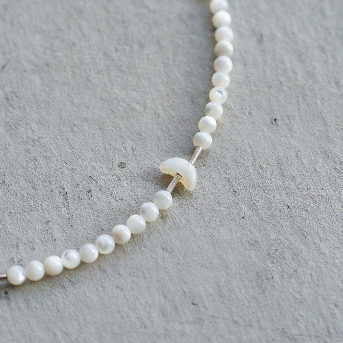 Melanie DeCourcey   Mother of pearl with silver tubes and mother of pearl moon shape
