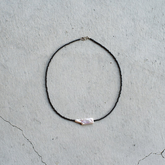 Melanie DeCourcey   Small black onyx with long pearl center