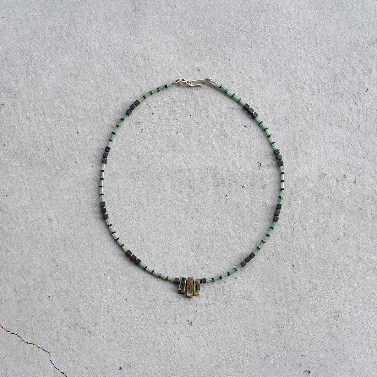 Melanie DeCourcey   Aventurine alternating with hematite and Abalone shell cennter