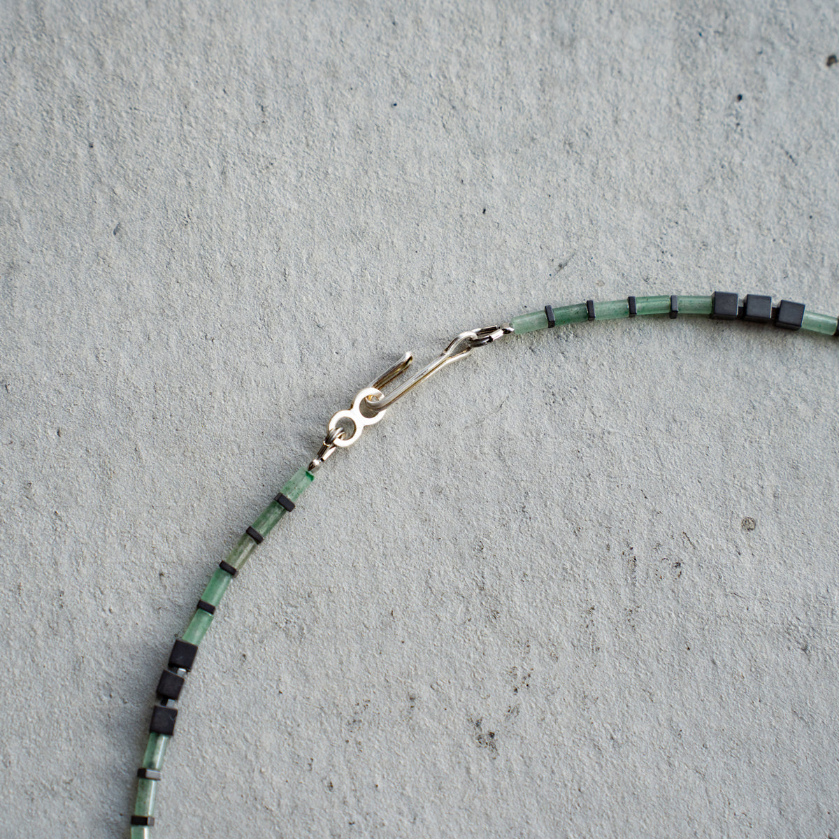 Melanie DeCourcey   Aventurine alternating with hematite and Abalone shell cennter