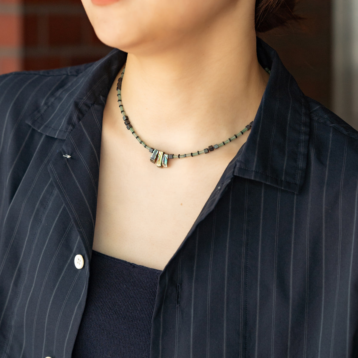 Melanie DeCourcey   Aventurine alternating with hematite and Abalone shell cennter