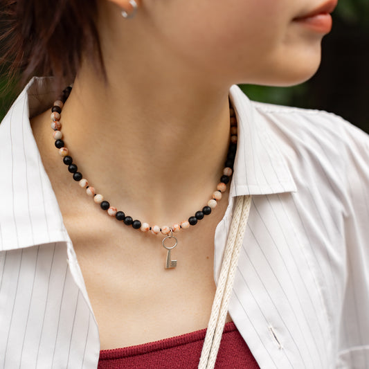 Melanie DeCourcey   Marble, matt onyx and spinel with silver key pendant