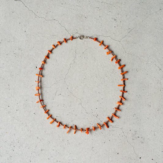 Melanie DeCourcey   Beaded necklace  -antique natural coral, African terracotta beads with tiny copper detail