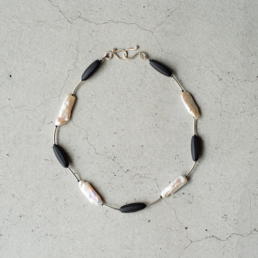 Melanie DeCourcey   Black mother of pearl, Czech glass beads, black spinel