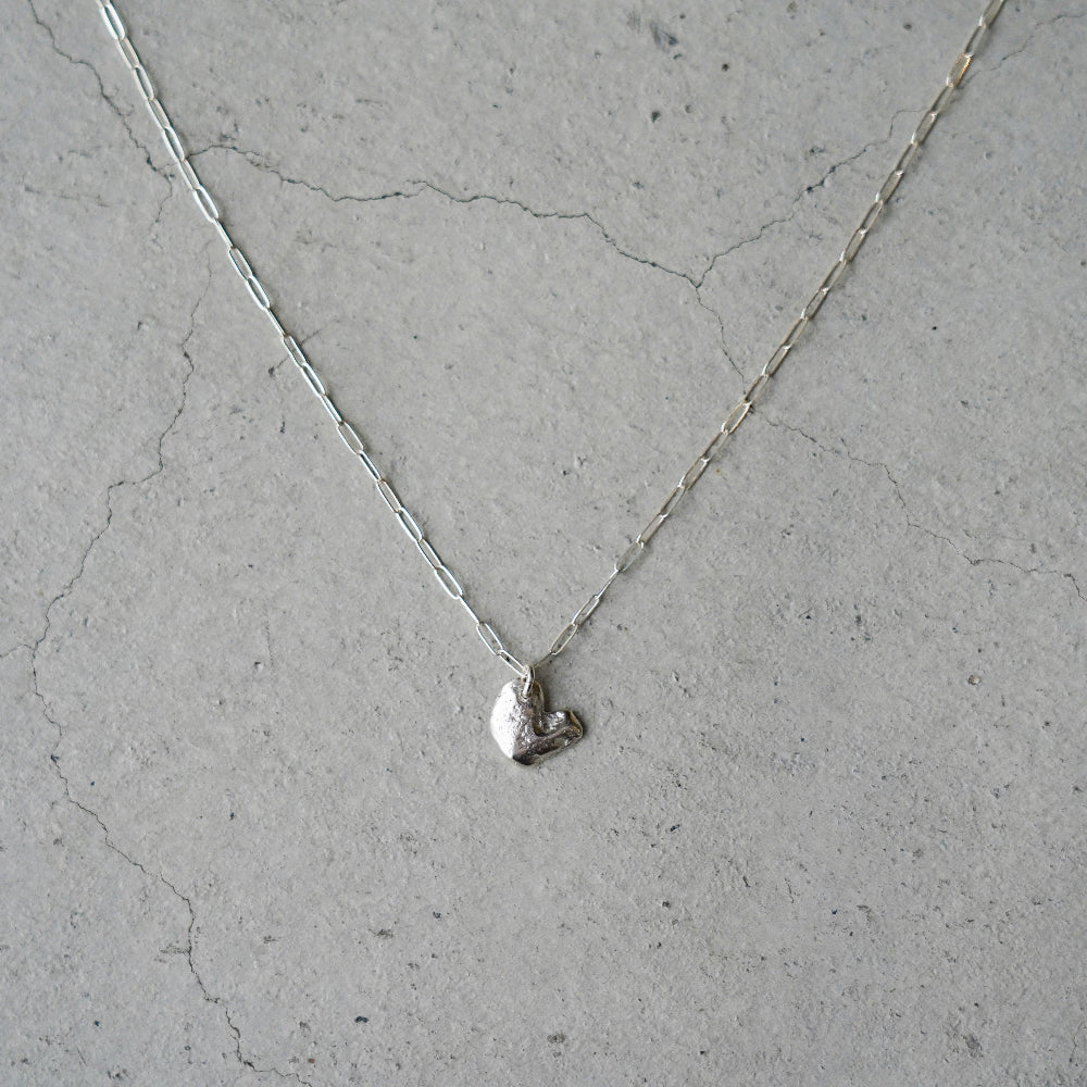 Melanie Decourcey Silver necklace with Freestyle silver heart pendant