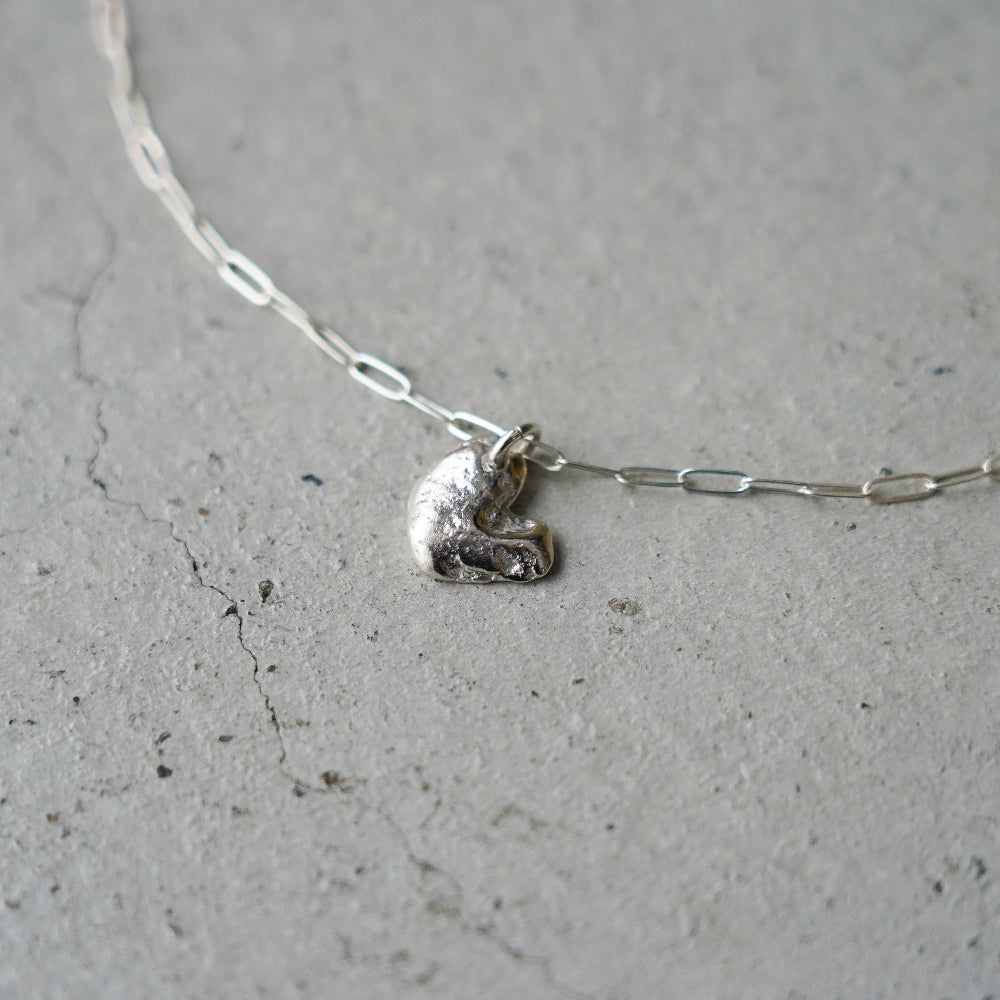 Melanie Decourcey Silver necklace with Freestyle silver heart pendant