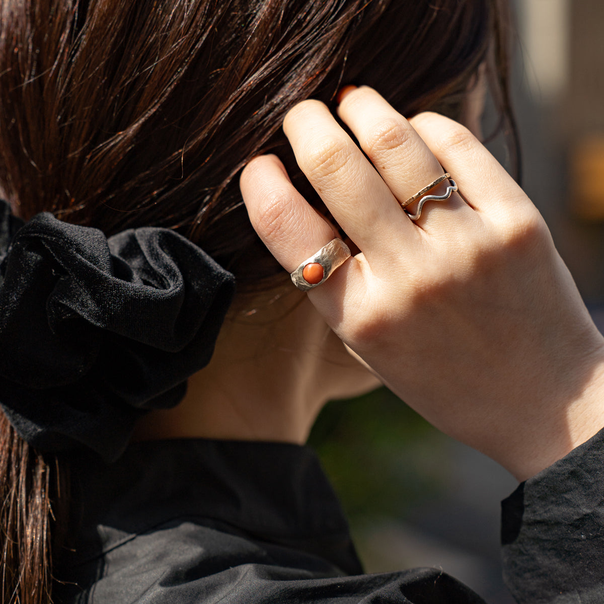 Melanie Decourcey  Textured silver ring with round coral