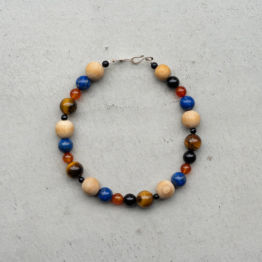 Melanie DeCourcey   Wood, lapis lazuli, carnelian agate, onyx and tiger eye necklace