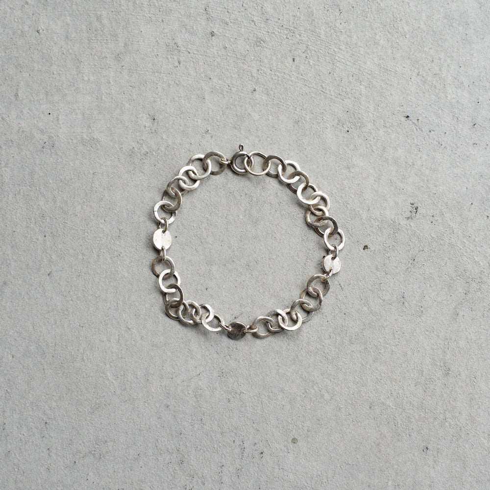 Melanie Decourcey  Open and full silver circle bracelet
