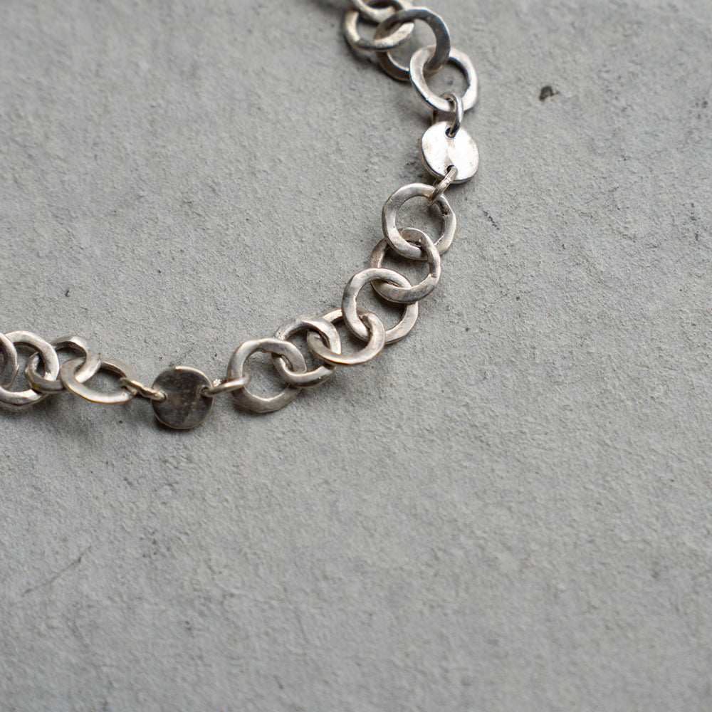 Melanie Decourcey  Open and full silver circle bracelet