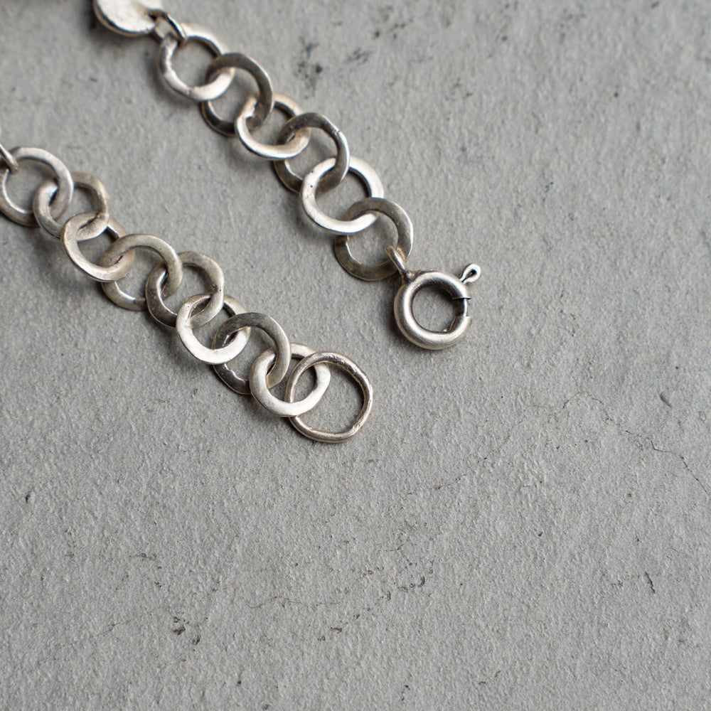 Melanie Decourcey  Open and full silver circle bracelet