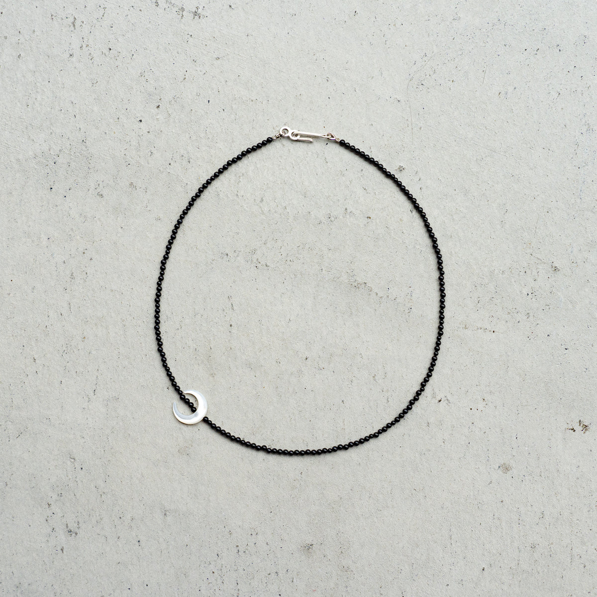 Melanie DeCourcey   Small onyx with mother of pearl moon