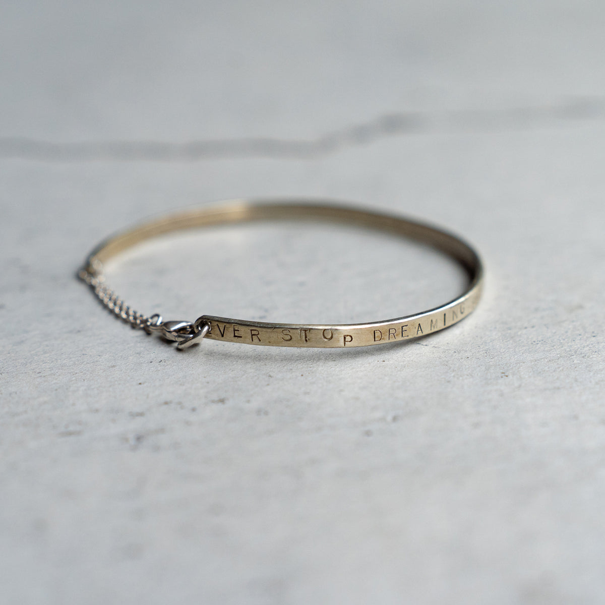 Melanie DeCourcey  Silver bracelet with chain closure "Never stop dreaming butterflies"