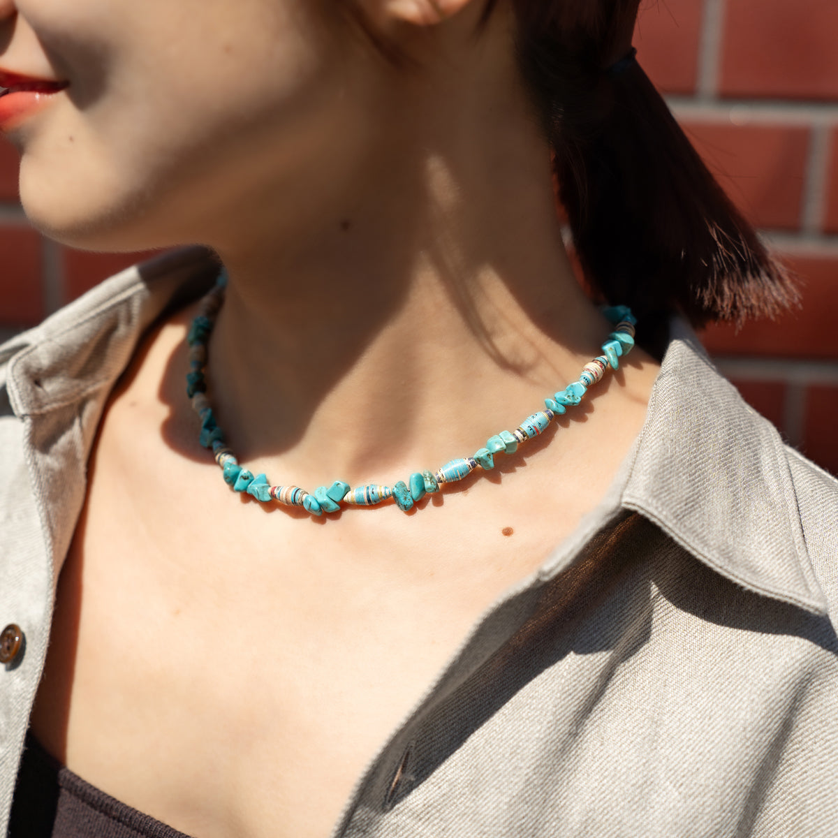 Melanie DeCourcey   Turquoise and multicolor African paper beads alternating