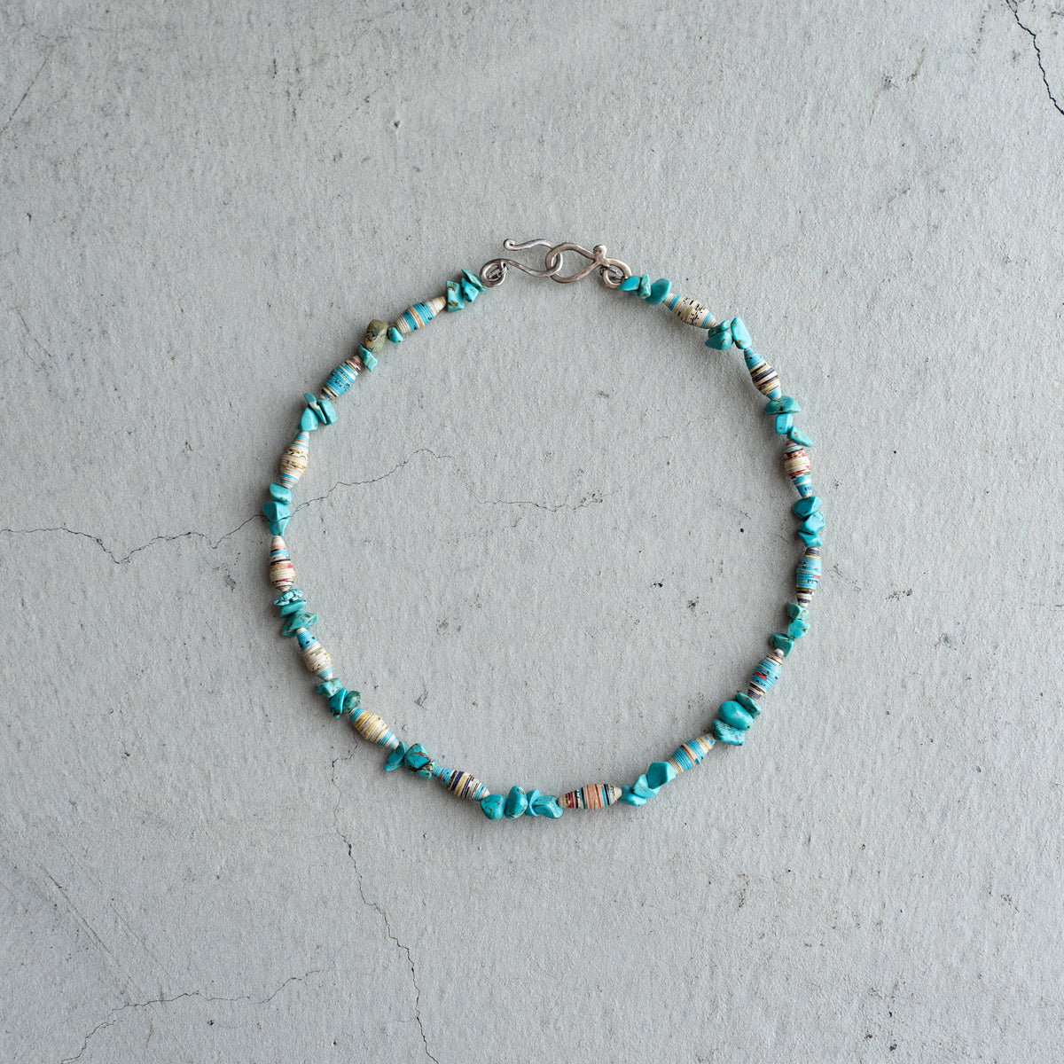 Melanie DeCourcey   Turquoise and multicolor African paper beads alternating