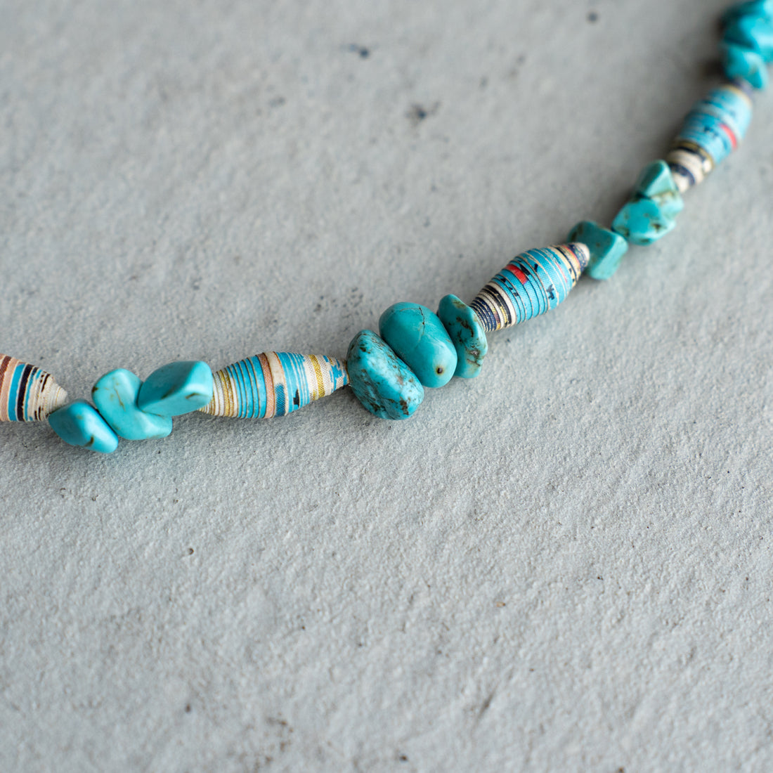 Melanie DeCourcey   Turquoise and multicolor African paper beads alternating