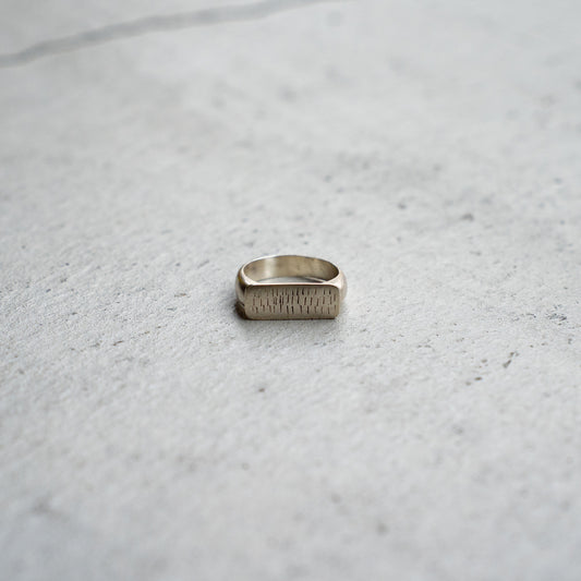 Melanie Decourcey  Silver ring with multiple vertical lines