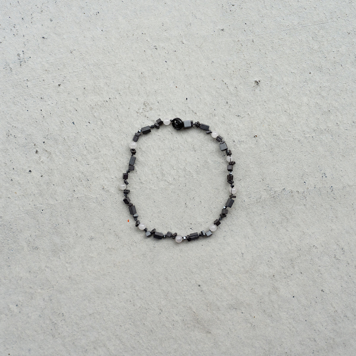 Melanie DeCourcey   DNA different shape hematite and rose quartz blacelet