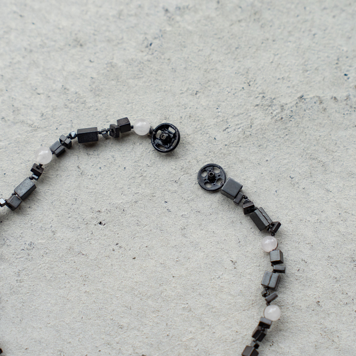 Melanie DeCourcey   DNA different shape hematite and rose quartz blacelet