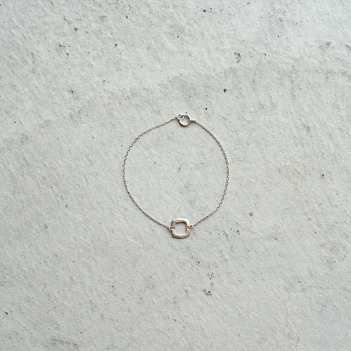 Melanie DeCourcey  Silver chain with small silver square bracelet