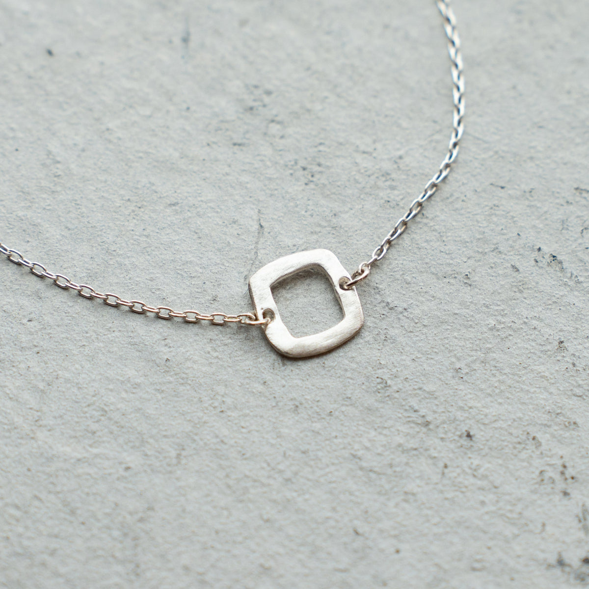 Melanie DeCourcey  Silver chain with small silver square bracelet