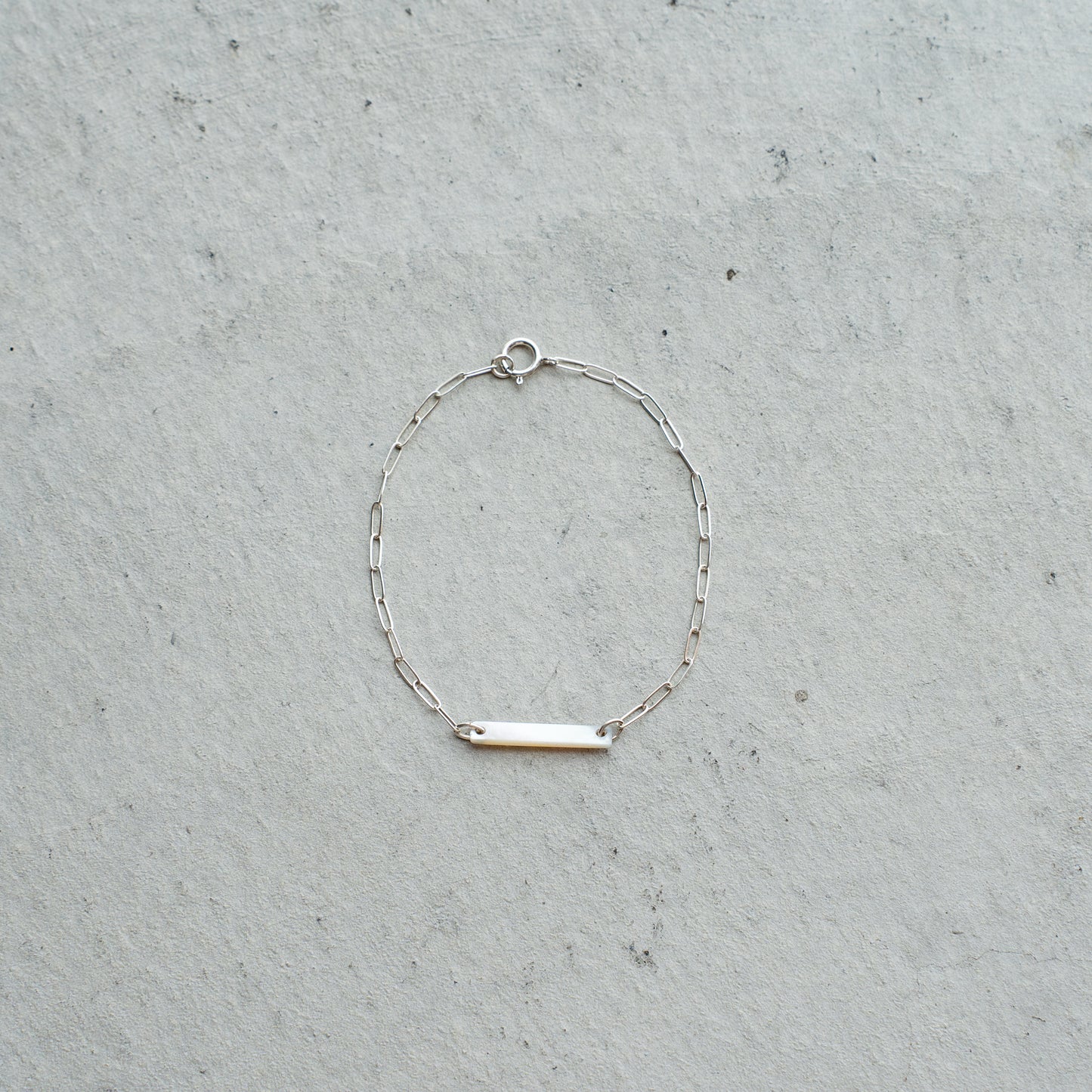 Melanie DeCourcey  Silver chain with long white mother of pearl square